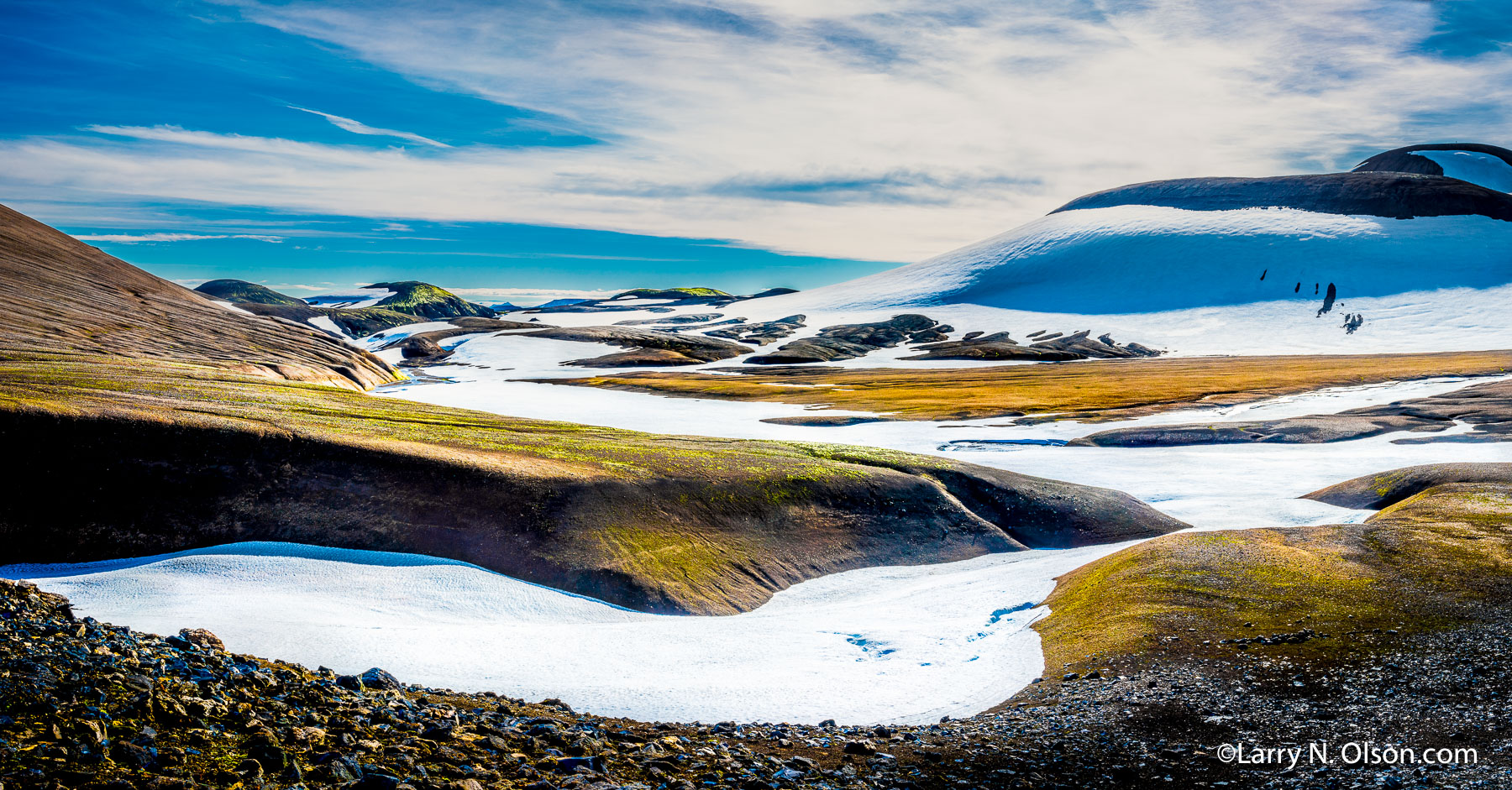Landmannalaugar, Iceland | Interesting shapes of the snowfields and glaciers make hiking the Landmannalaugar in Iceland very unique.