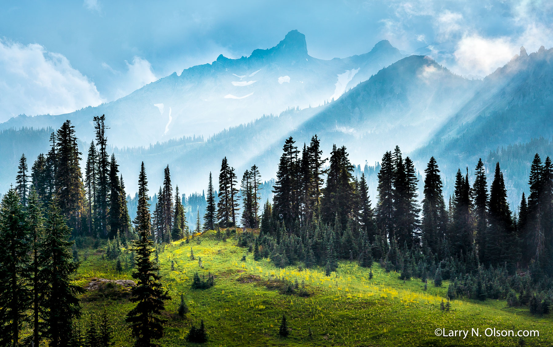 Cowlitz Chimneys, Mount Rainier National Park, WA | Beautiful light rays and fog shroud the Cowlitz Chimneys and Barrier Peak in Mount Rainier National Park, WA