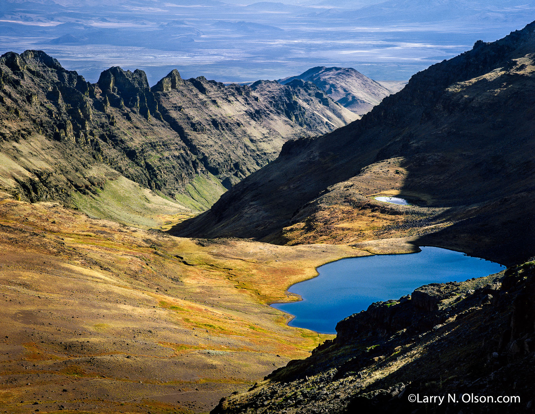 Wild Horse Lake, Steens Mountain, OR | Fall colors and afternoon light show off the volcanic and glaciated landscape.