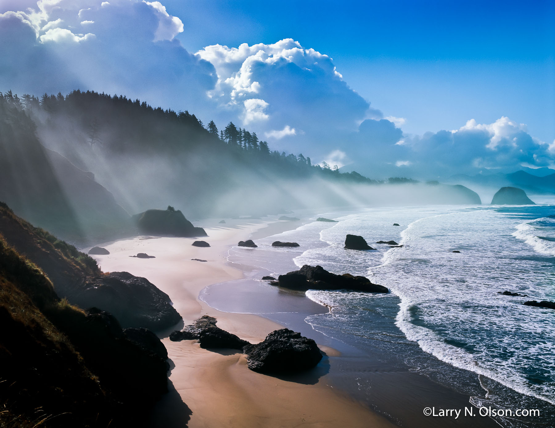Crescent Beach #3, Ecola State Park, OR. | Dramatic light illuminates the clouds, and beach while surf rolls onto the shore at low tide.