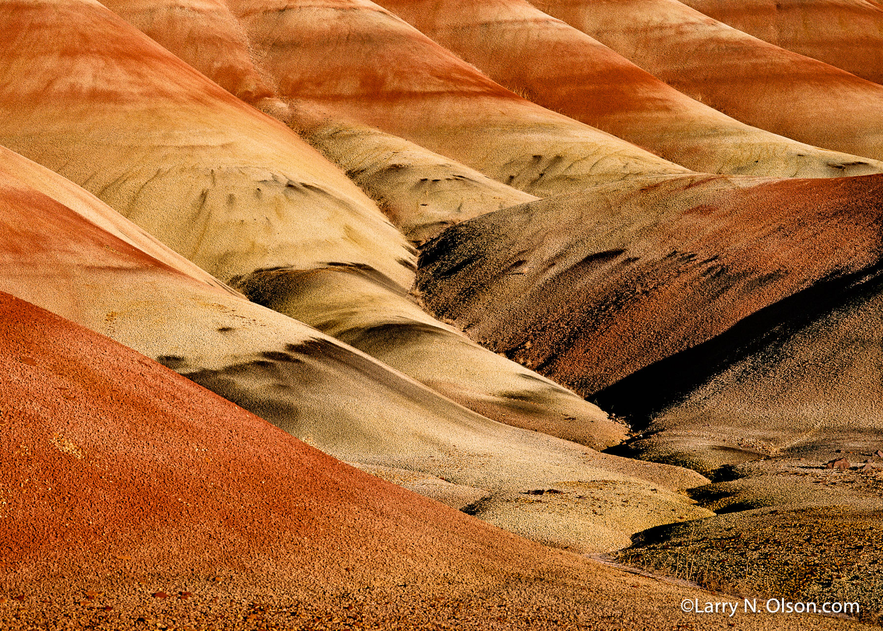 Painted Hills, Oregon | The Painted Hills are named after the colorful layers of its hills corresponding to various geological eras, formed when the area was an ancient river floodplain.