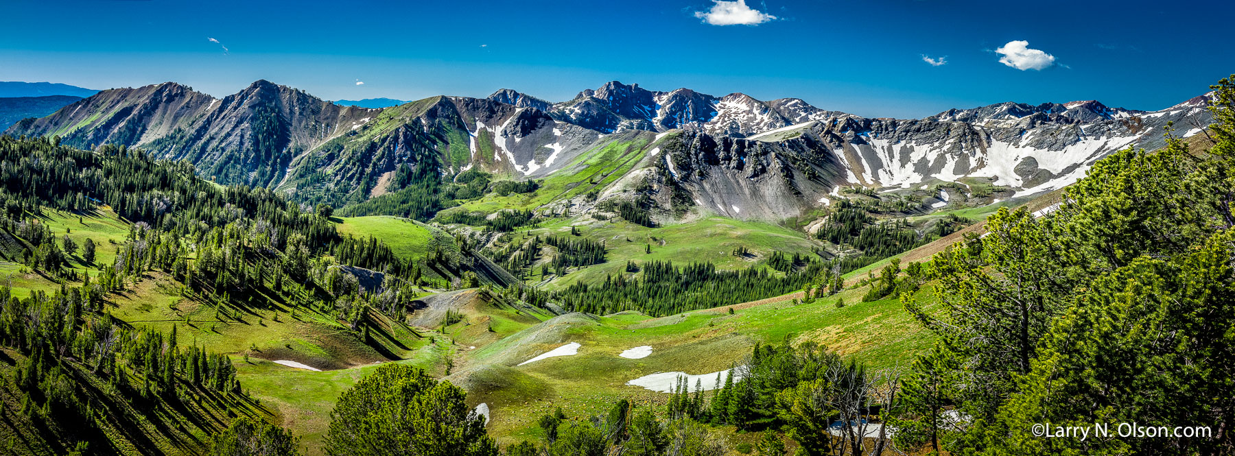 North Fork, Imnaha River Canyon, OR | Lingering snowfields and the fresh green meadows of June as seen from Tenderfoot Pass, in Eagle Cap Wilderness.