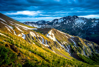 West Ridge, Aneroid Mountain, OR | Late evening sun lights up Aneroid's west ridge while the snow covered slopes of Peats Point and Sentinal Mountain are in the shadows of Eagle Cap Wilderness.