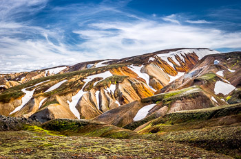 Landmannalaugar, Iceland | Interesting shapes of the snowfields and glaciers make hiking the Landmannalaugar in Iceland very unique.
