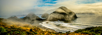 Sisters Rock State Park, Oregon | Driving south from Port Orford in a dense summer sea fog, the late evening breeze magically offered me this glimpse of Sisters Rock. I had to pull over and make photographs until the fog began to settle in again.