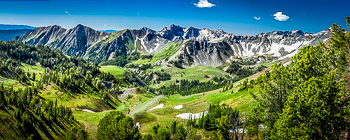 North Fork, Imnaha River Canyon, OR | Lingering snowfields and the fresh green meadows of June as seen from Tenderfoot Pass, in Eagle Cap Wilderness.