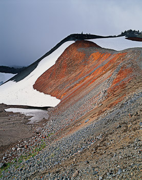 Cinder Slope, Three Sisters Wilderness, OR | Snow covered, rusty red volcanic cinders can be seen in the lateral morain of an ancient glacier.