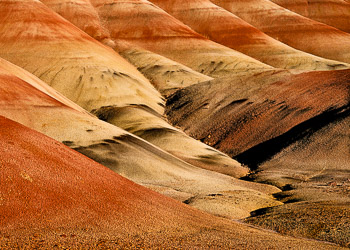 Painted Hills, Oregon | The Painted Hills are named after the colorful layers of its hills corresponding to various geological eras, formed when the area was an ancient river floodplain.