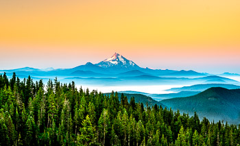 Mount Jefferson, Mount Hood Wilderness, OR | Pre-dawn light on Mount Jefferson as seen from Mount Hood. This photograph was made on a summer backpacking trip to Mt. Hood’s Paradise Park.  The Ollallie Lakes basin is shrouded by fog in the foreground. As of early October 2020, the Lionshead Fire was still burning in this area.